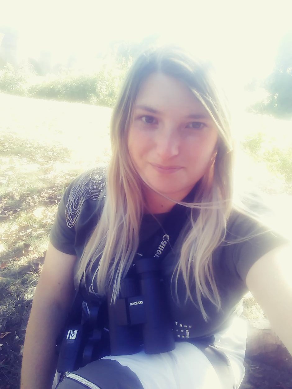 Harriet Day A picture of Harriet Day with binoculars and camera