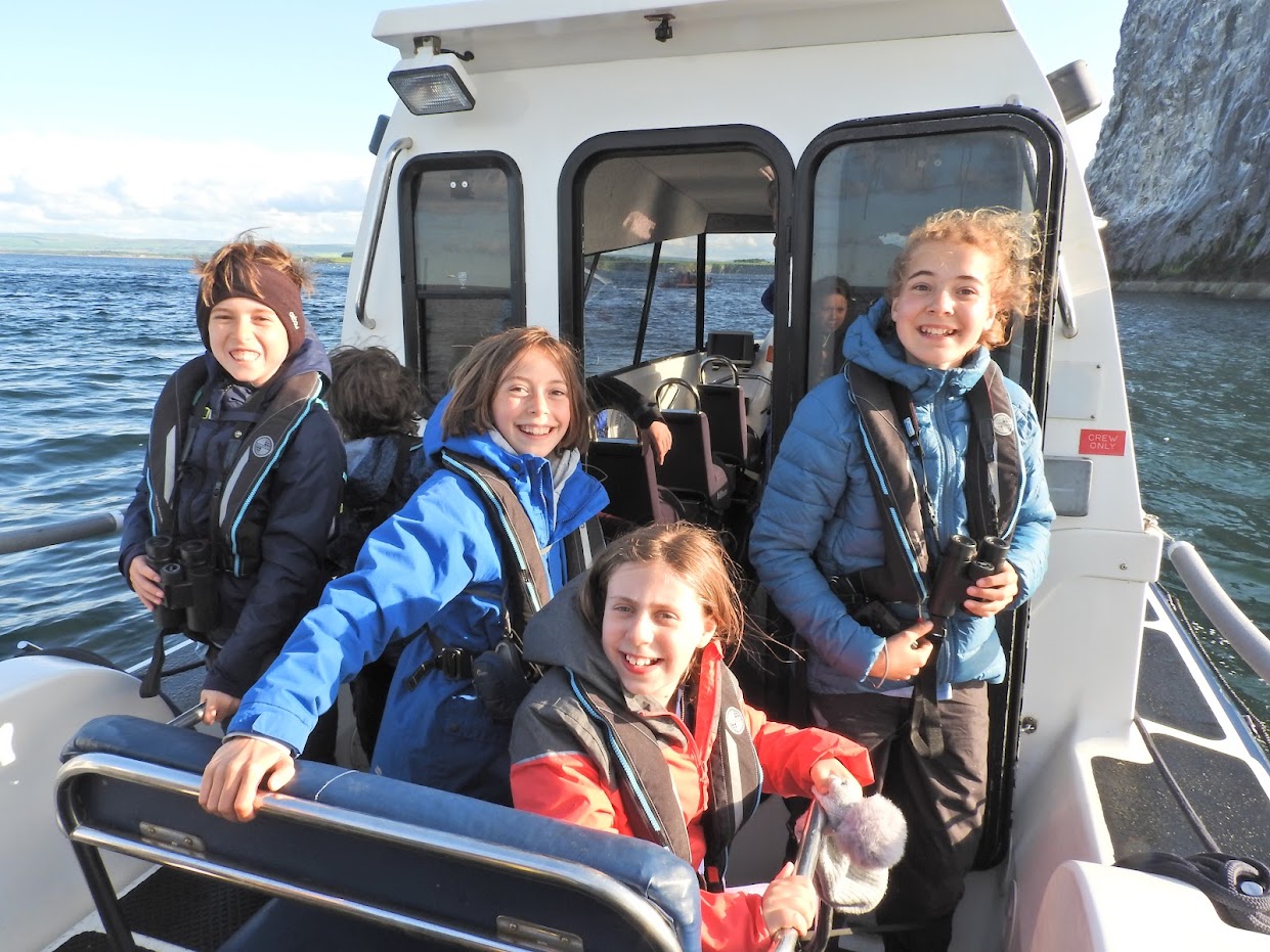 Participants of the SOC/BTO Scottish Bird Camp 2023 on a boat trip to Bass Rock. 