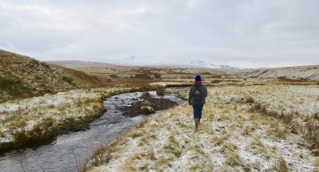 Gethin walking along a snowy riverbank Gethin walking along a snowy riverbank